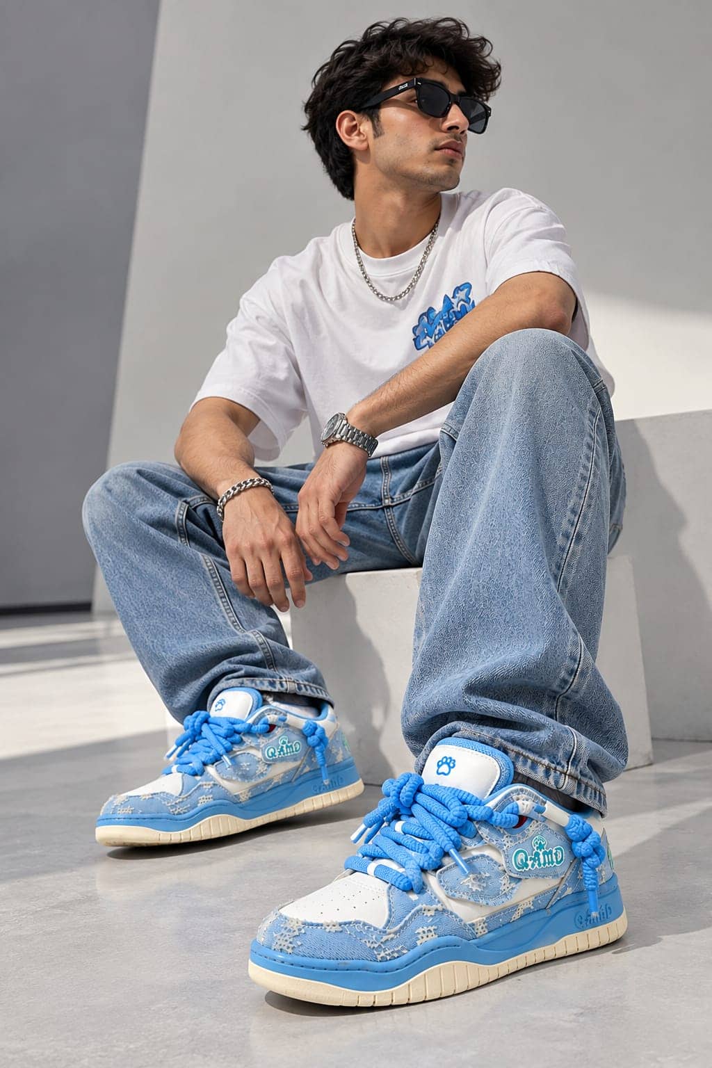 A customer wearing QAMO denim sneakers